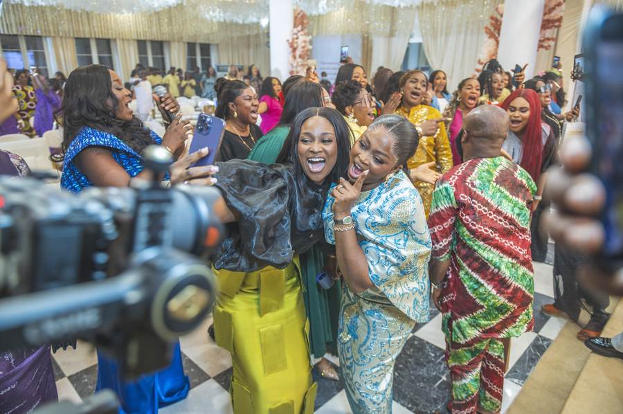 Candid laughter between guests at Echoes of Worship
